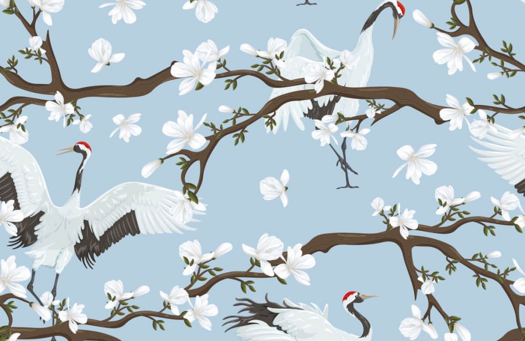 Grues sur des branches de printemps