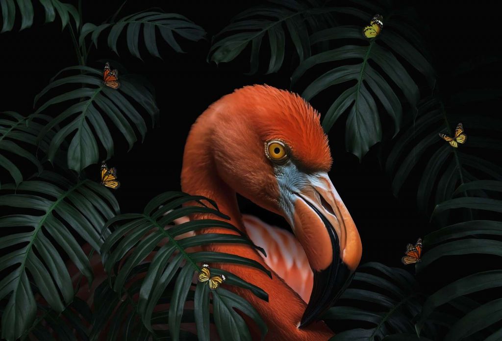 Flamant entre le vert tropical